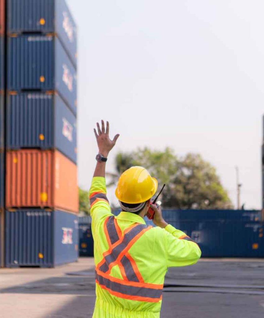 Marine professional inspecting cargo operations at a commercial shipping terminalMarine professional inspecting cargo operations at a commercial shipping terminal